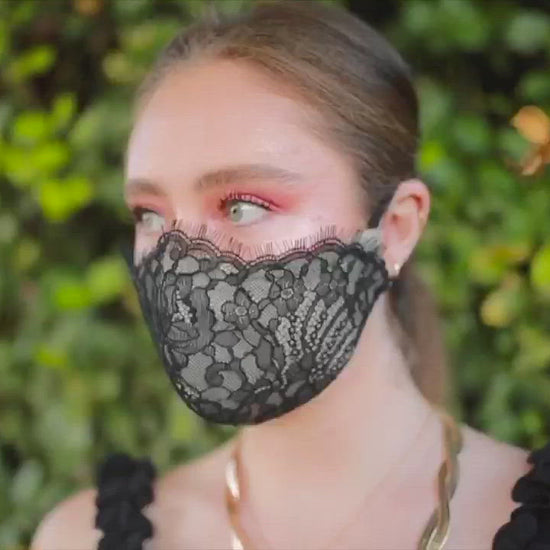 Woman wearing black eyelash face mask